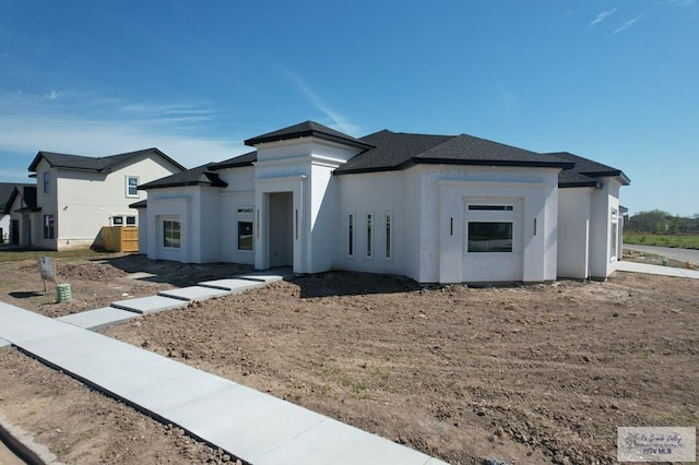 prairie-style house with stucco siding