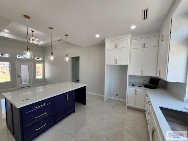 kitchen featuring recessed lighting, blue cabinets, visible vents, white cabinets, and light countertops