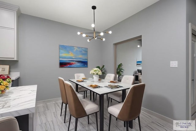 dining area featuring a chandelier