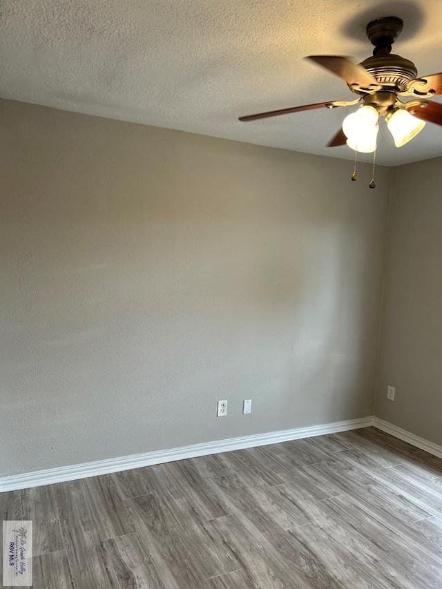 spare room featuring ceiling fan, a textured ceiling, and light hardwood / wood-style flooring