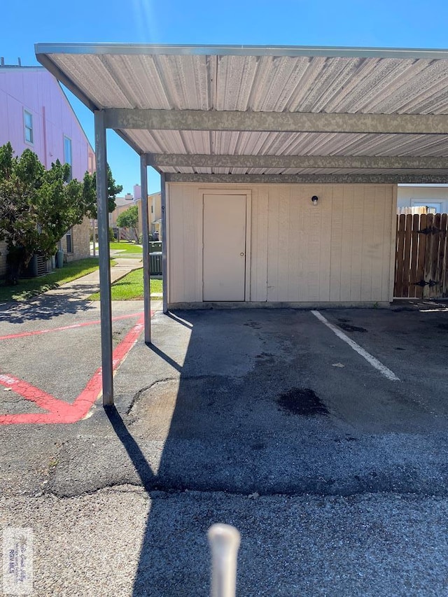 exterior space featuring a carport