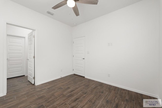 unfurnished bedroom with dark hardwood / wood-style floors and ceiling fan