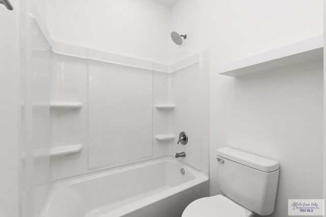 bathroom featuring shower / bathing tub combination and toilet