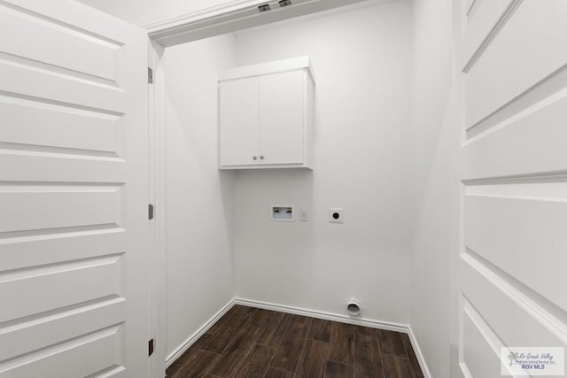 laundry room with electric dryer hookup, dark hardwood / wood-style flooring, cabinets, and washer hookup