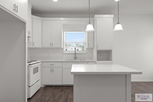 kitchen featuring white cabinets, white electric range, decorative light fixtures, and sink