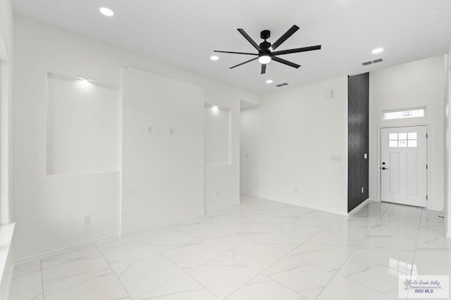 unfurnished room featuring ceiling fan