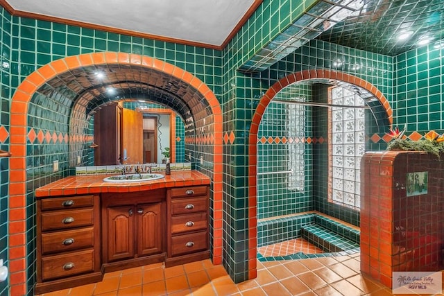 bathroom featuring tile walls, vanity, and tile patterned flooring