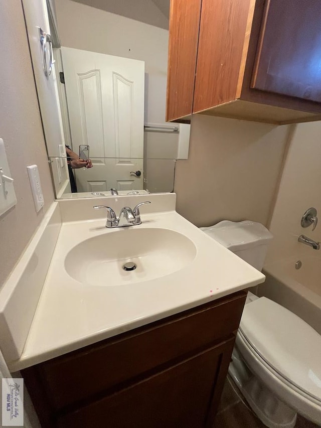 full bathroom featuring vanity, toilet, and bathing tub / shower combination