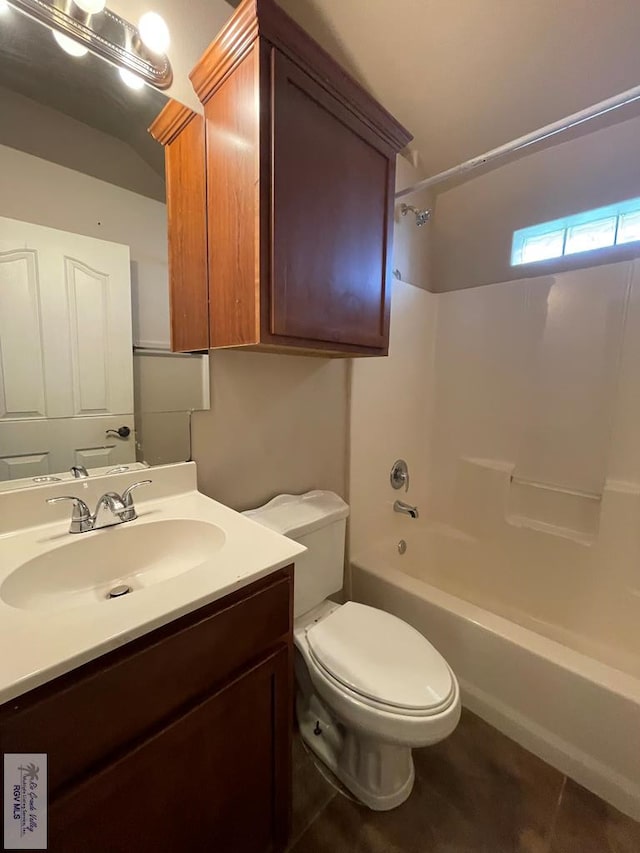 full bathroom with tile patterned flooring, vanity, toilet, and  shower combination