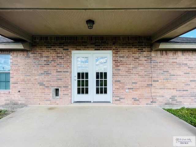 doorway to property featuring a patio area and french doors