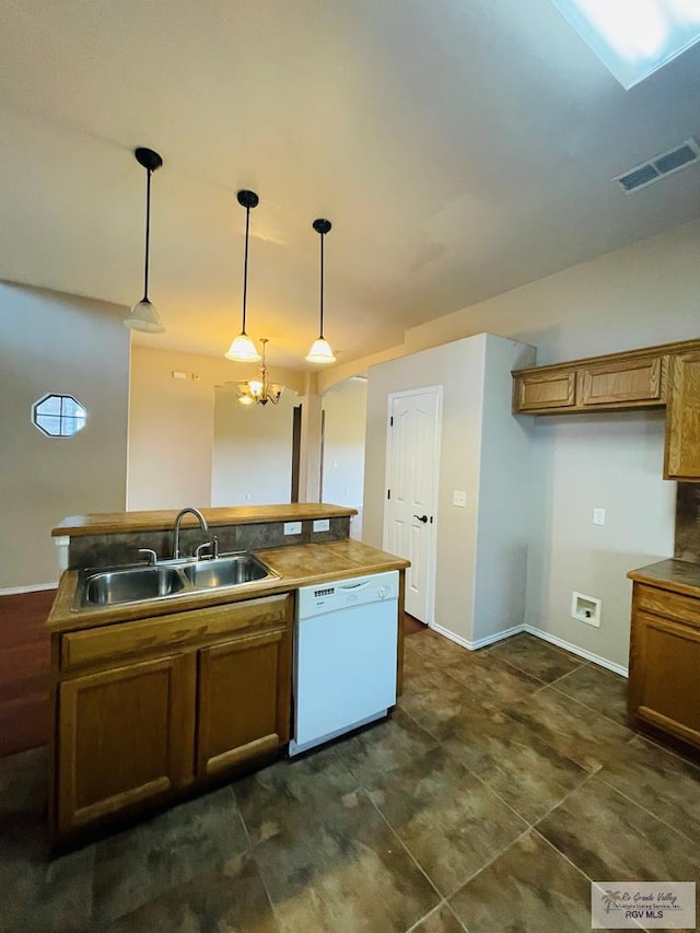 kitchen with dishwasher, an inviting chandelier, decorative light fixtures, and sink