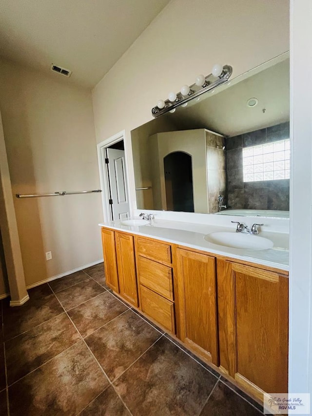 bathroom featuring tile patterned floors and vanity