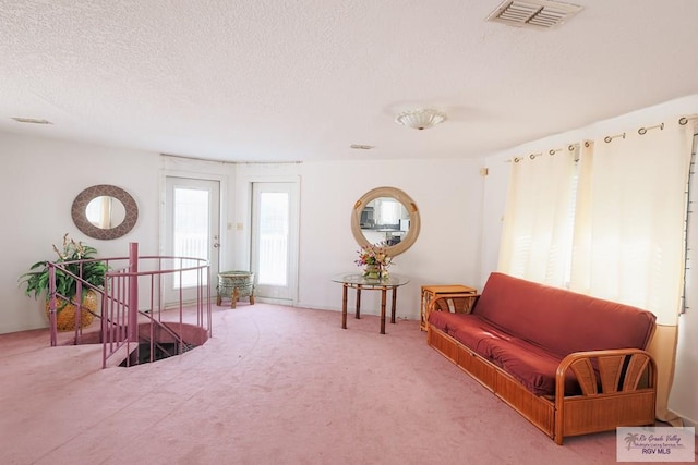 109 E Pompano St, South Padre Island, TX 78597 - living area with an upstairs landing, a textured ceiling, and carpet flooring