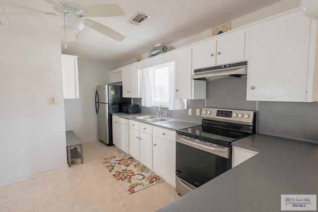 109 E Pompano St, South Padre Island, TX 78597 - kitchen featuring appliances with stainless steel finishes, under cabinet range hood, white cabinetry, and ceiling fan