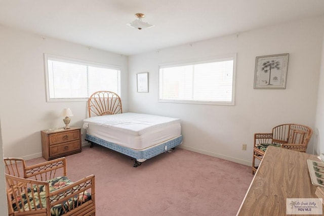 109 E Pompano St, South Padre Island, TX 78597 - bedroom with baseboards and carpet