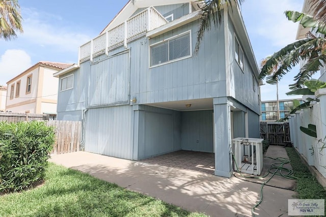 109 E Pompano St, South Padre Island, TX 78597 - back of house with a fenced backyard