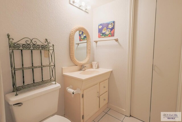 109 E Pompano St, South Padre Island, TX 78597 - half bath with vanity and tile patterned floors