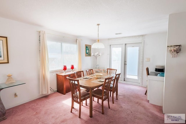 109 E Pompano St, South Padre Island, TX 78597 - dining room featuring healthy amount of natural light and light colored carpet