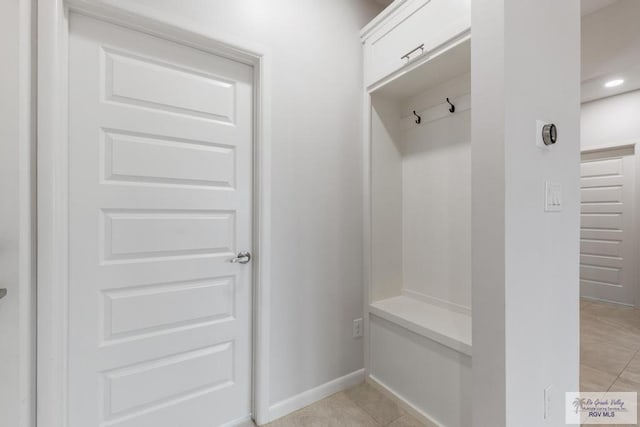 mudroom with light tile patterned floors