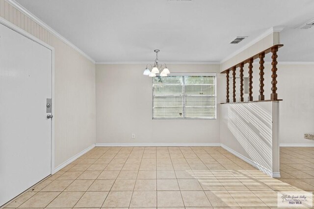 unfurnished room with a notable chandelier, visible vents, light tile patterned floors, and ornamental molding