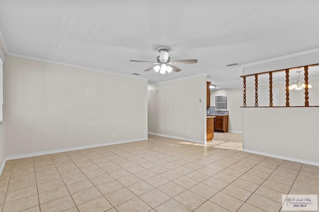 empty room featuring visible vents, ornamental molding, light tile patterned flooring, baseboards, and ceiling fan