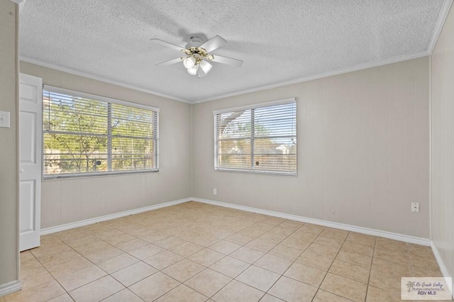 spare room featuring a textured ceiling, ornamental molding, and a ceiling fan