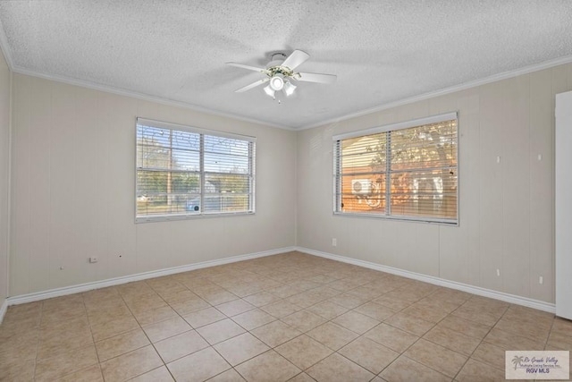 spare room featuring light tile patterned flooring, a textured ceiling, ceiling fan, and crown molding