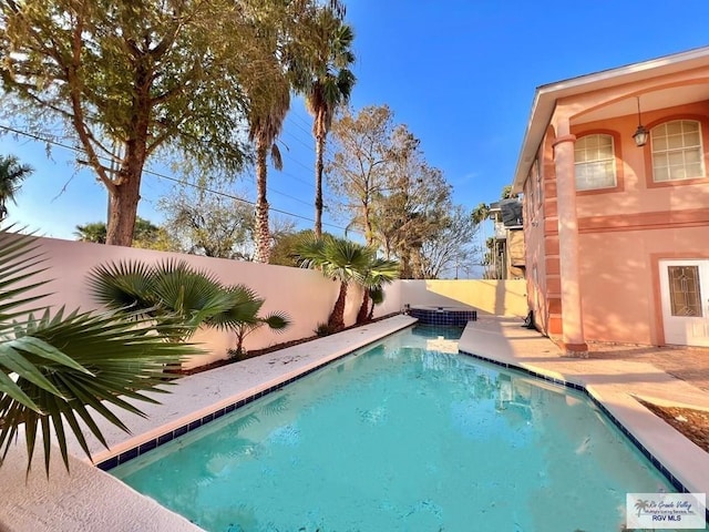 144 Country Club Rd Unit 1, Brownsville, TX 78520 - view of swimming pool featuring a fenced in pool, a patio area, and a fenced backyard