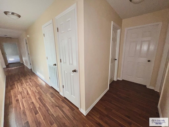 144 Country Club Rd Unit 1, Brownsville, TX 78520 - corridor with baseboards and dark wood finished floors