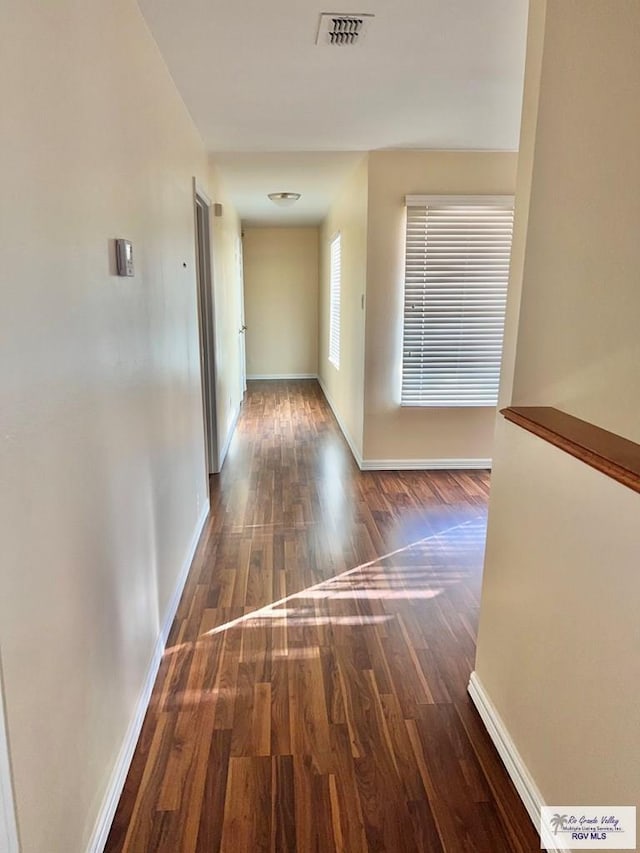 144 Country Club Rd Unit 1, Brownsville, TX 78520 - corridor featuring visible vents, baseboards, and wood finished floors