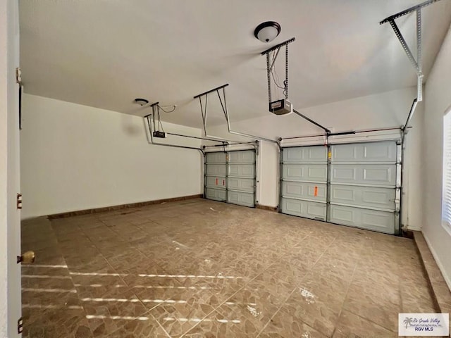 144 Country Club Rd Unit 1, Brownsville, TX 78520 - garage featuring a garage door opener and baseboards