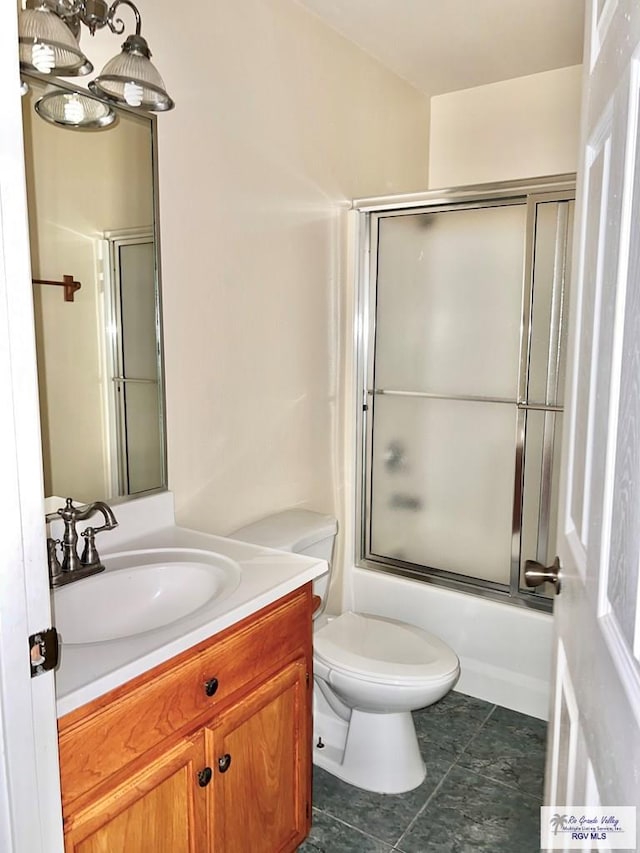 144 Country Club Rd Unit 1, Brownsville, TX 78520 - full bath with toilet, enclosed tub / shower combo, vanity, and tile patterned flooring