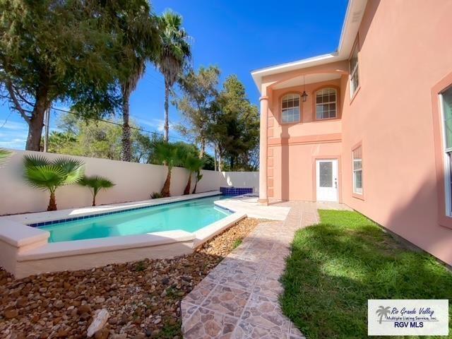 144 Country Club Rd Unit 1, Brownsville, TX 78520 - view of pool featuring a fenced in pool, a patio, and a fenced backyard