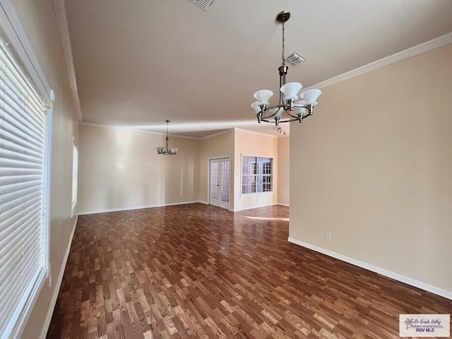 144 Country Club Rd Unit 1, Brownsville, TX 78520 - unfurnished living room featuring ornamental molding, baseboards, a notable chandelier, and wood finished floors