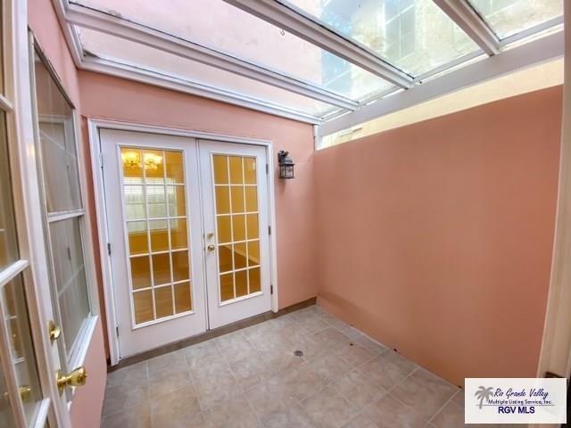 144 Country Club Rd Unit 1, Brownsville, TX 78520 - interior space featuring a skylight and french doors