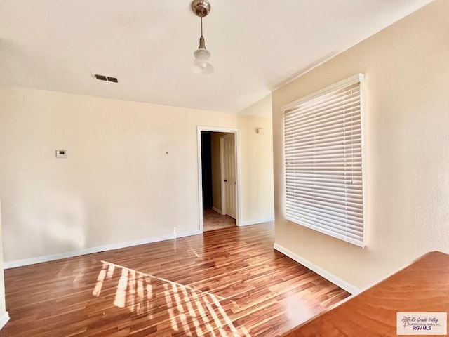 144 Country Club Rd Unit 1, Brownsville, TX 78520 - spare room featuring visible vents, baseboards, and wood finished floors