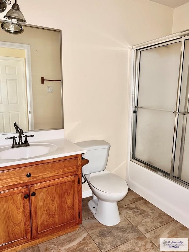 144 Country Club Rd Unit 1, Brownsville, TX 78520 - full bath with toilet, enclosed tub / shower combo, and vanity