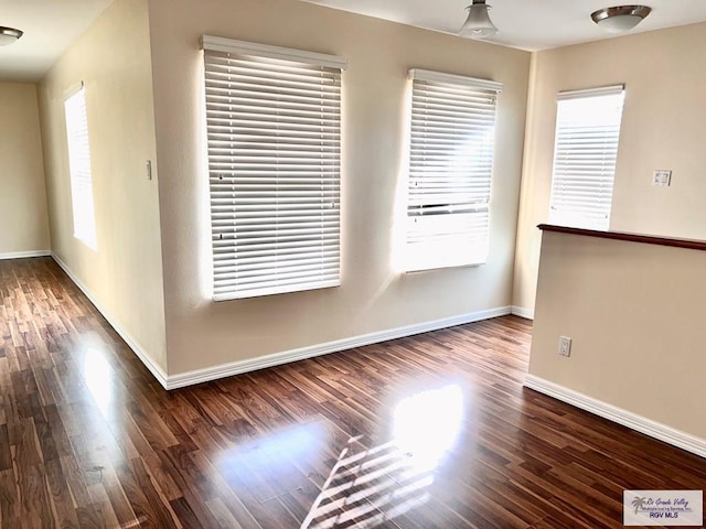 144 Country Club Rd Unit 1, Brownsville, TX 78520 - spare room with baseboards and wood finished floors