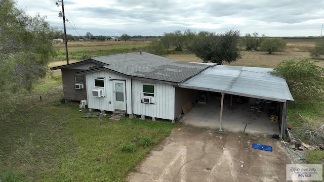 5660 N Mile 11, Mercedes, TX 78570 - view of outbuilding featuring cooling unit, a carport, driveway, and a rural view