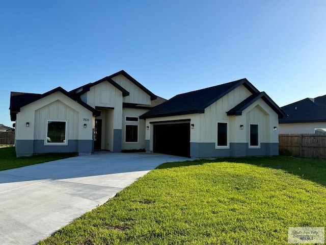 7533 Hana Dr, Brownsville, TX 78520 - modern farmhouse style home with board and batten siding, driveway, and an attached garage