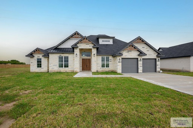 view of front facade featuring a garage and a front lawn