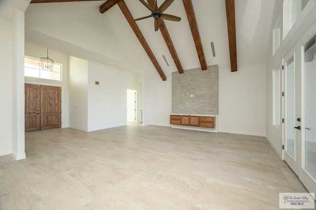 unfurnished living room featuring beamed ceiling, high vaulted ceiling, and ceiling fan