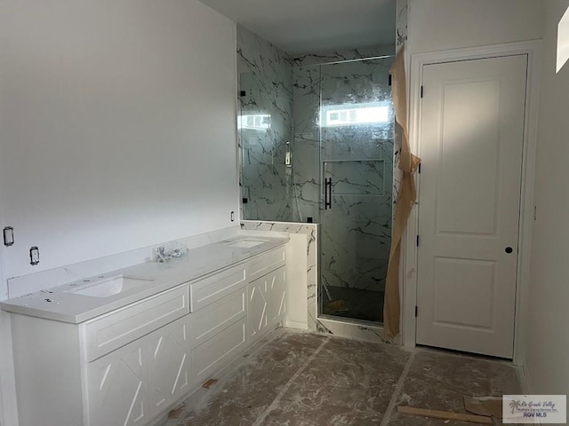 bathroom featuring vanity and a shower with shower door