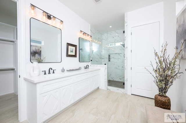 bathroom with vanity, wood-type flooring, and a shower with shower door