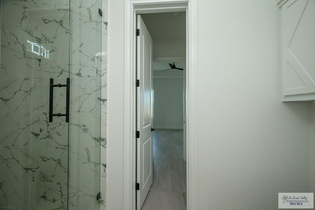 bathroom with tiled shower