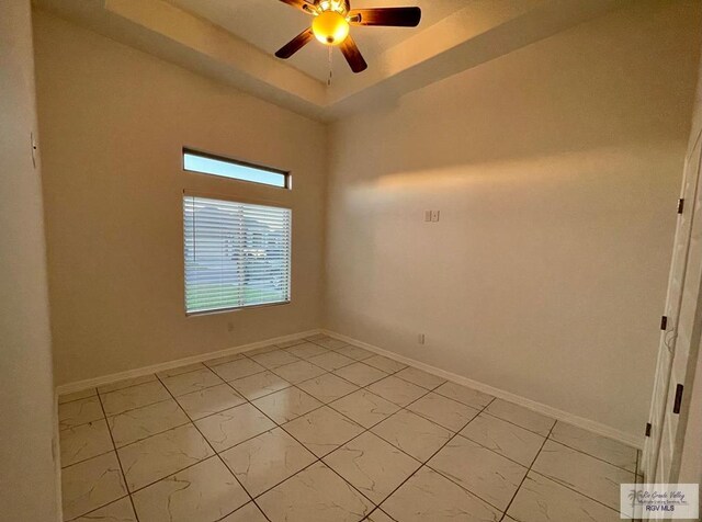 spare room with ceiling fan