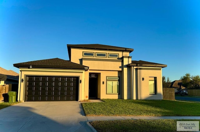 prairie-style house with a front yard and a garage