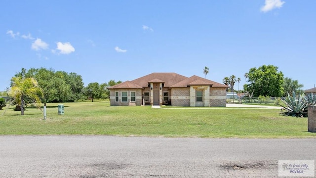 34164 Quail Dr, San Benito, TX 78586 - view of front of house with brick siding