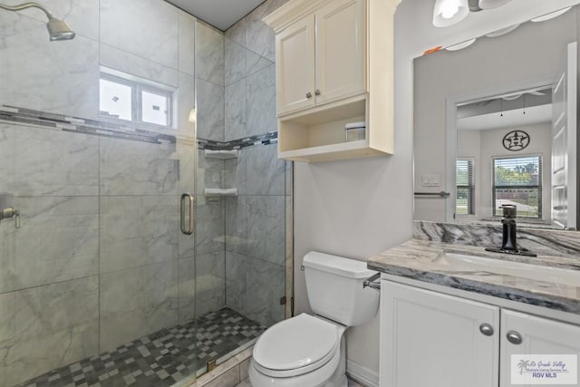 34164 Quail Dr, San Benito, TX 78586 - full bathroom with toilet, a stall shower, and vanity