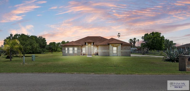 34164 Quail Dr, San Benito, TX 78586 - view of front of home with a yard